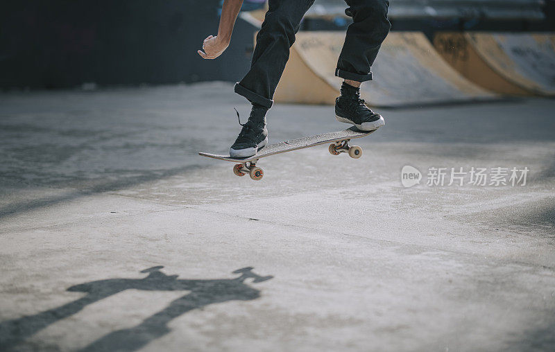 Asian skateboarder in action mid air x games